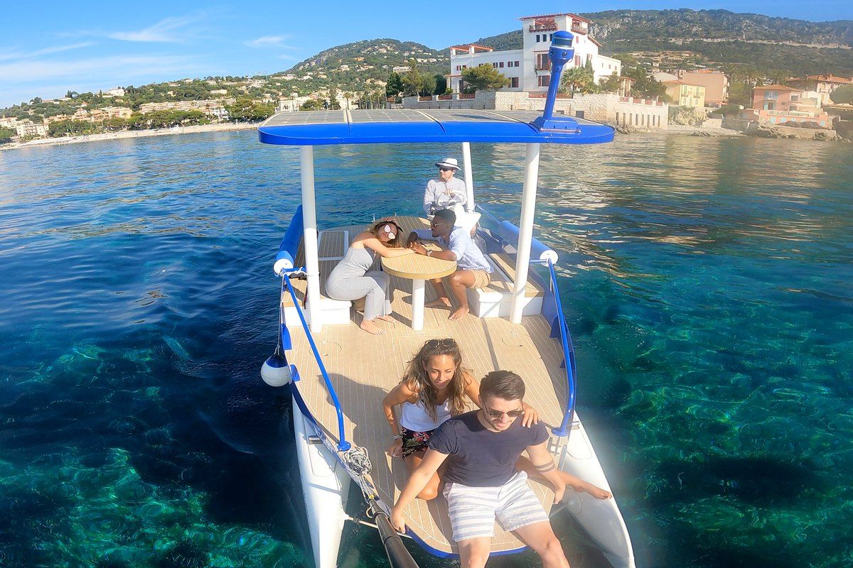 Seazen's solar-powered catamaran on clear turquoise water off Beaulieu-sur-Mer