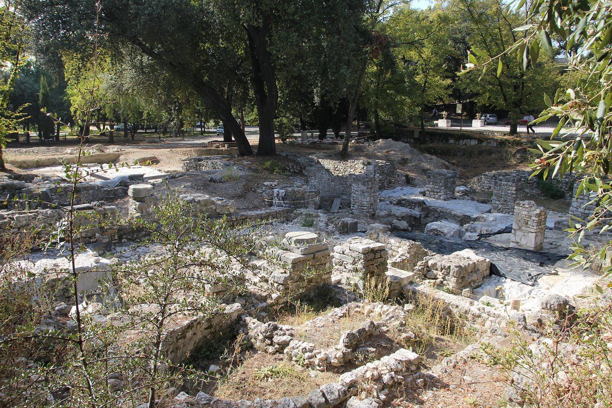 Old stone ruins among the pines and olive trees at the top of Castle Hill, Nice