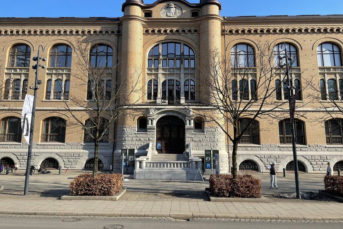 The sandstone façade and arched entrance of the Historical Museum on Frederiks gate, Oslo