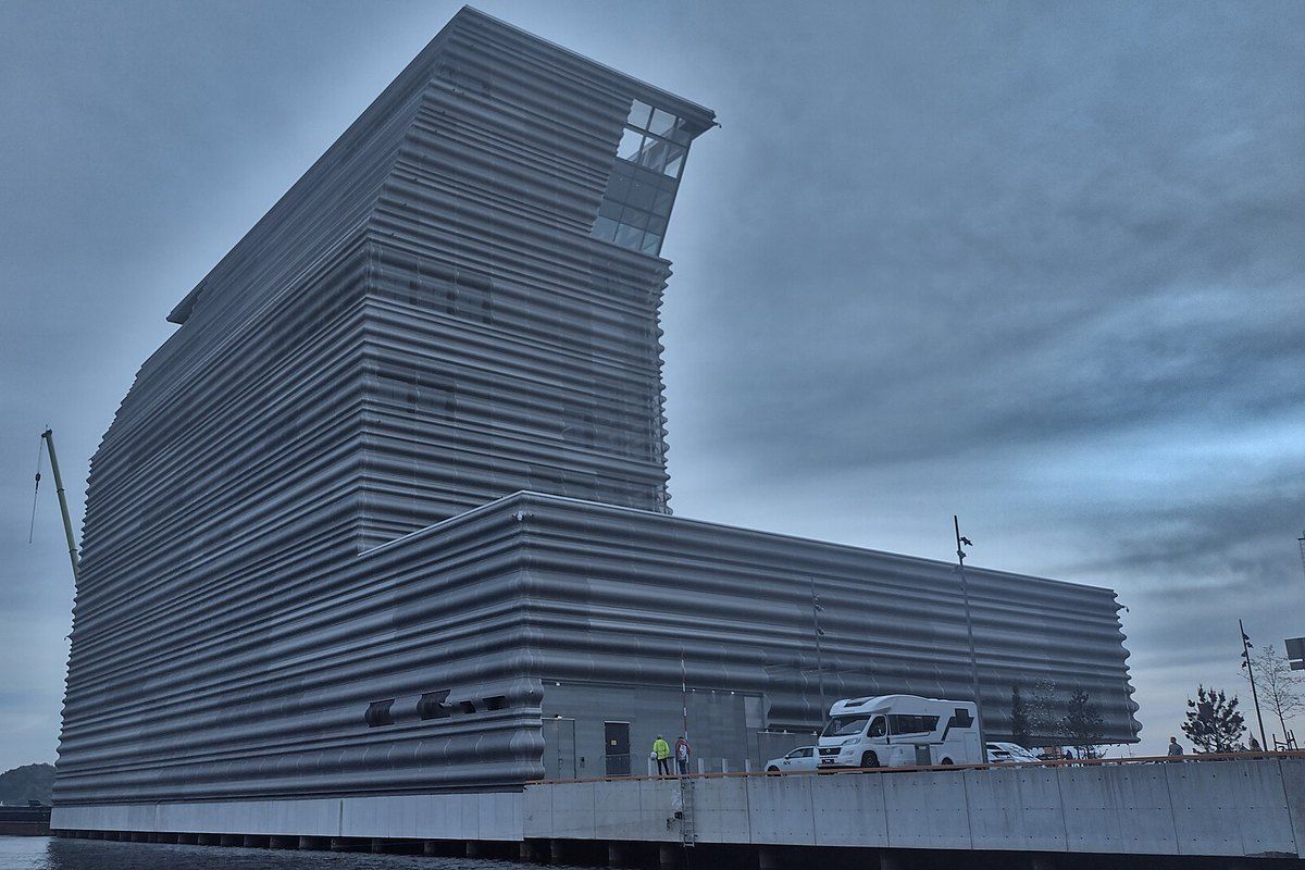 The leaning, aluminium-clad tower of the MUNCH museum on the waterfront at Bjørvika, Oslo