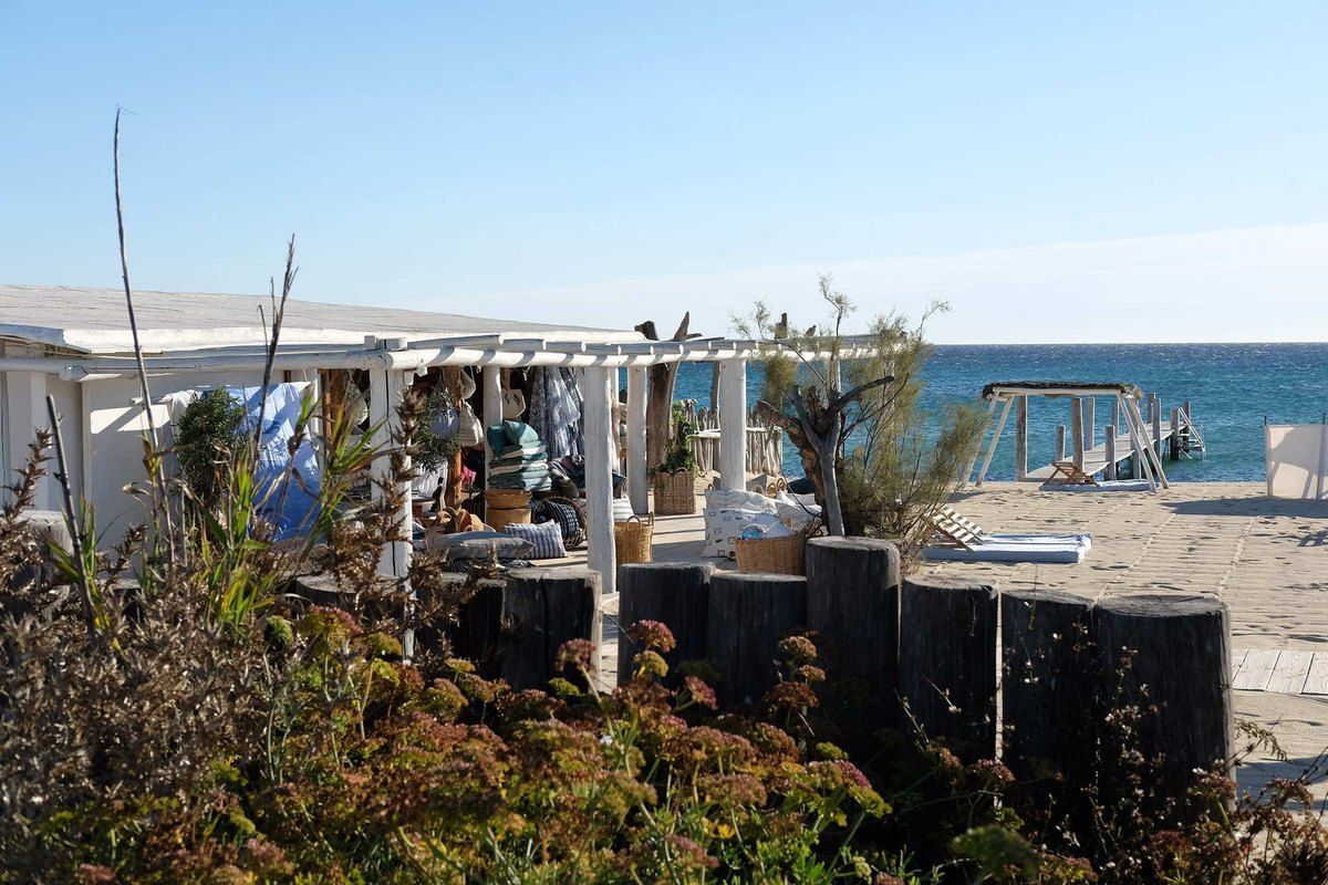 The white-canopied beach restaurant of Club 55 by the sea on Pampelonne