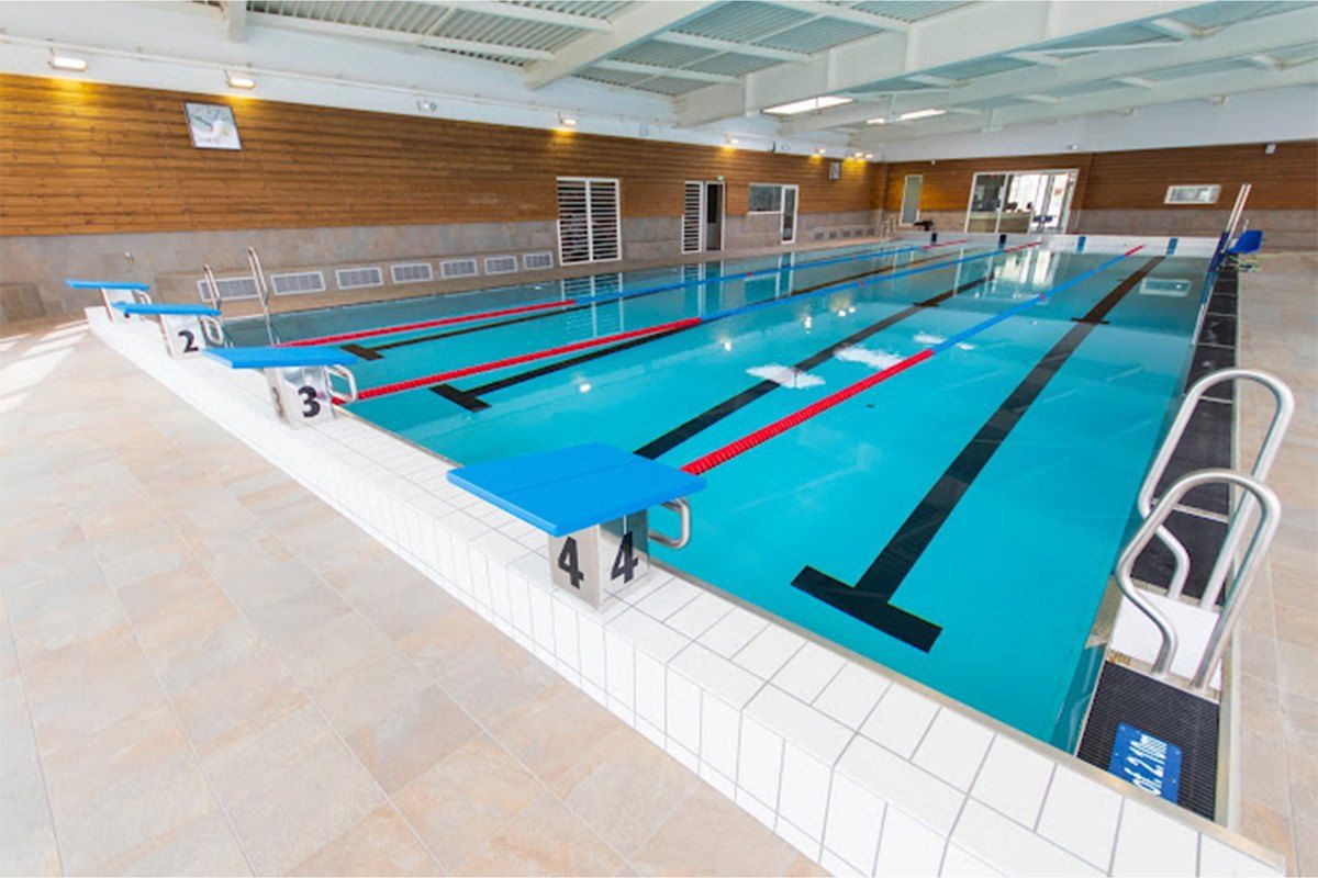 The bright indoor lane pool of Les Bains du Cap aquatic centre in Roquebrune-Cap-Martin