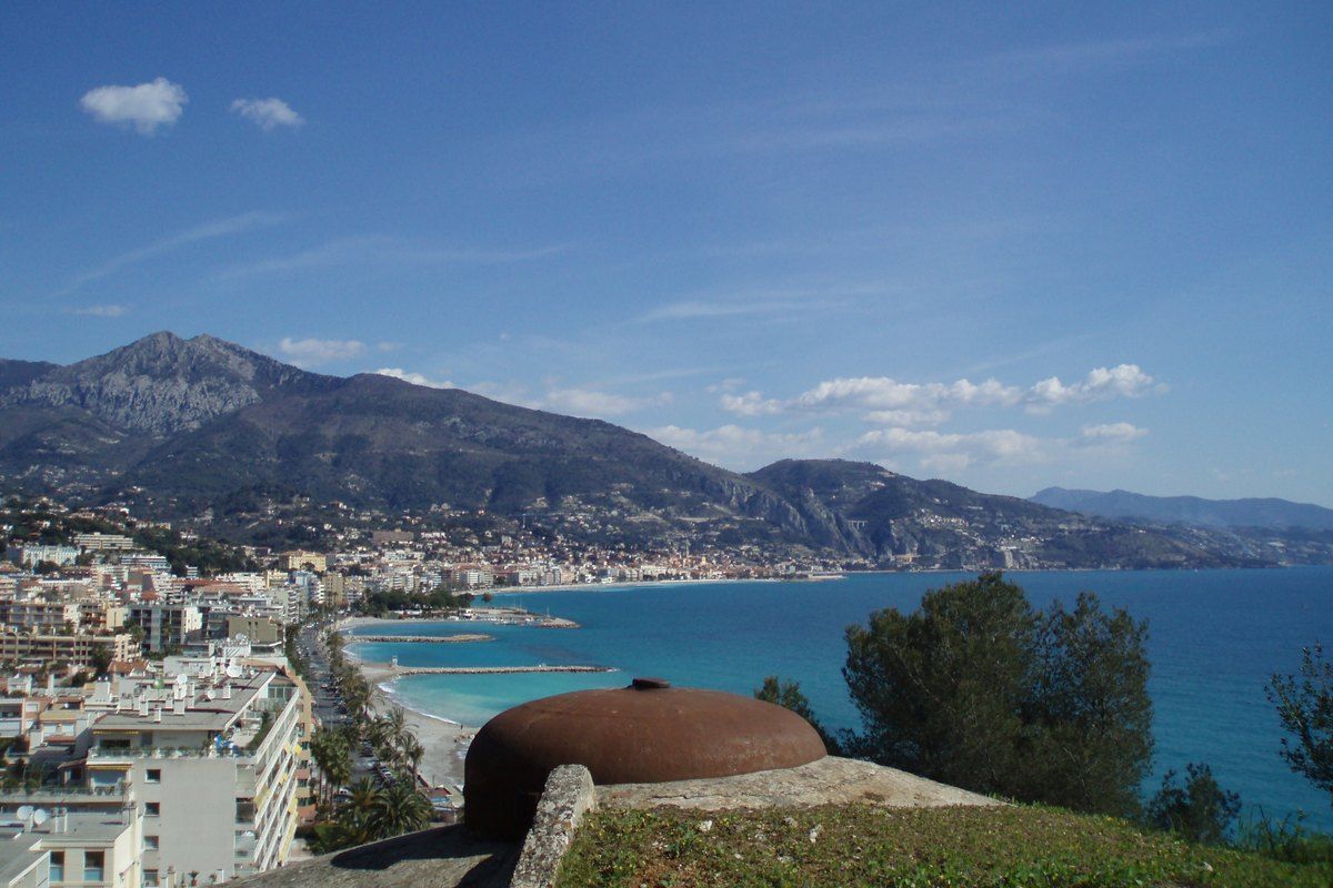 The armoured turret of the Maginot Line Fort du Cap-Martin looking over the bay of Menton and the mountains
