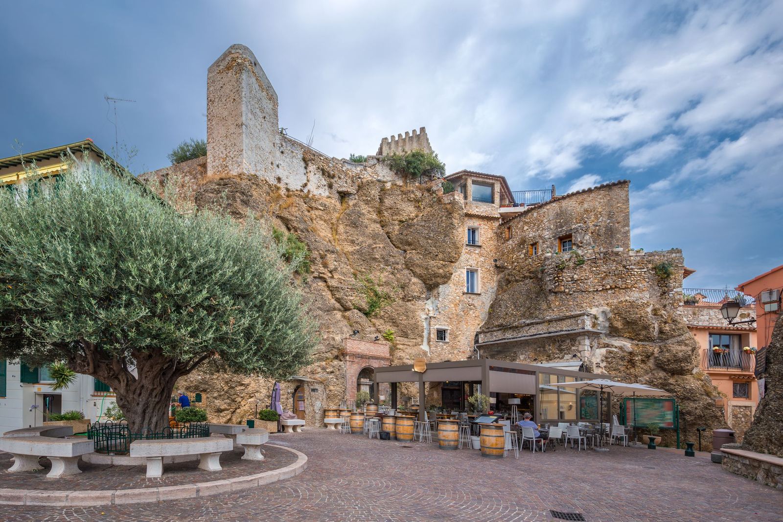 Café tables on the square below the castle in Roquebrune's old village