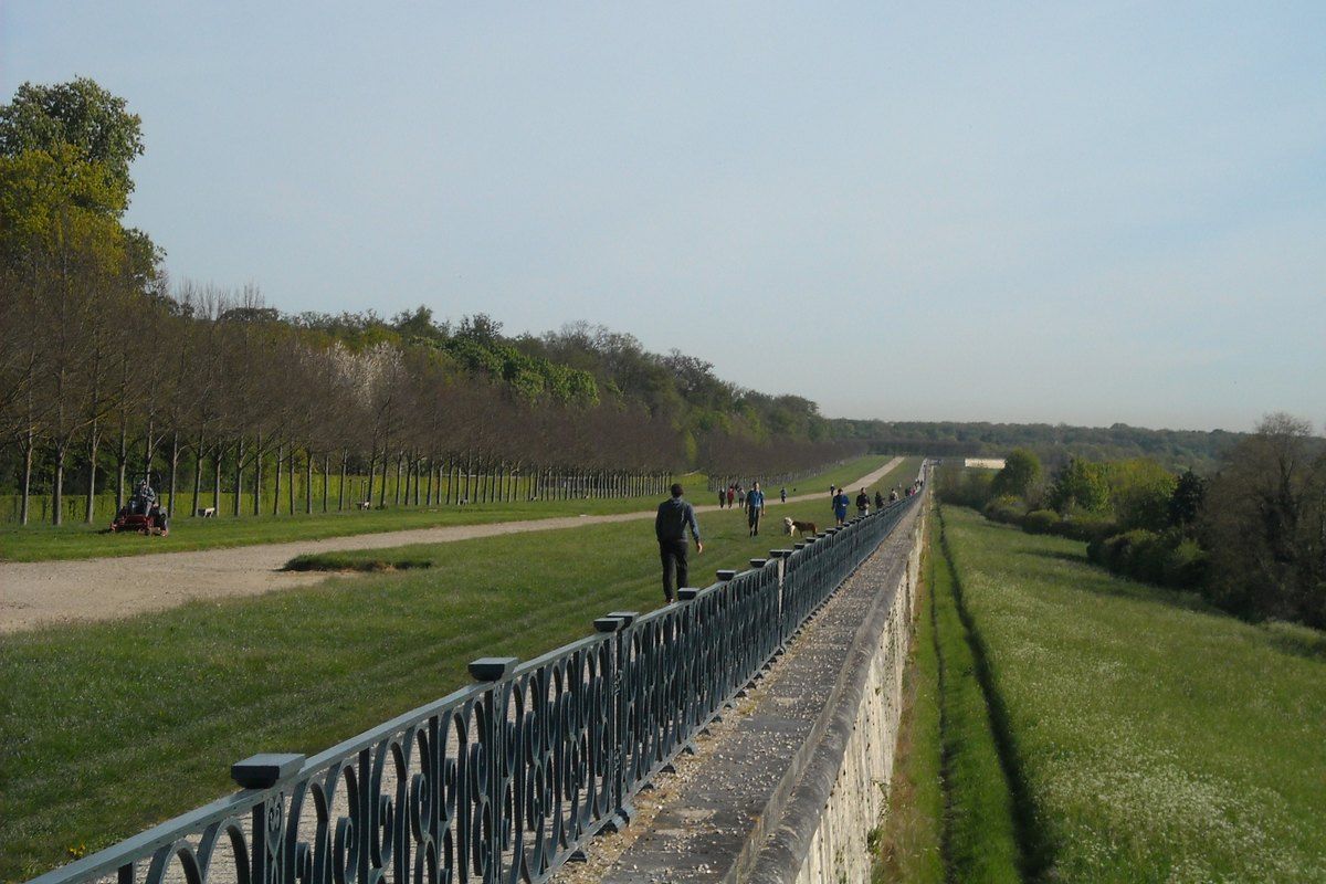 The iron railing and gravel walk of the Grande Terrasse stretching towards the forest at Saint-Germain-en-Laye