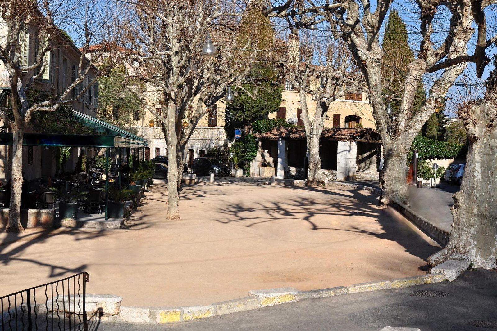 Café tables on the Place du Jeu de Boules in Saint-Paul-de-Vence