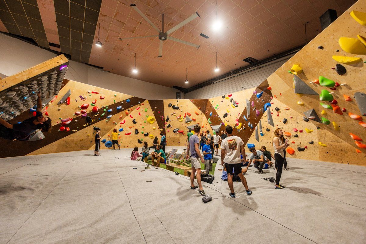 Climbers of all ages in the bouldering hall at Val de Grimpe in Villeneuve-Loubet