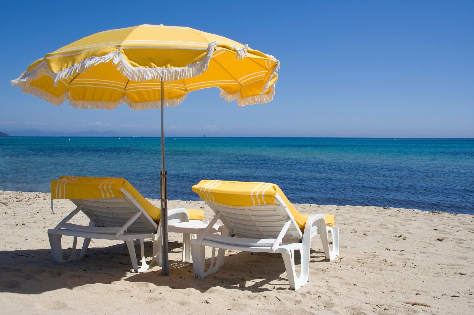 Loungers and parasols on a beach at Saint-Tropez