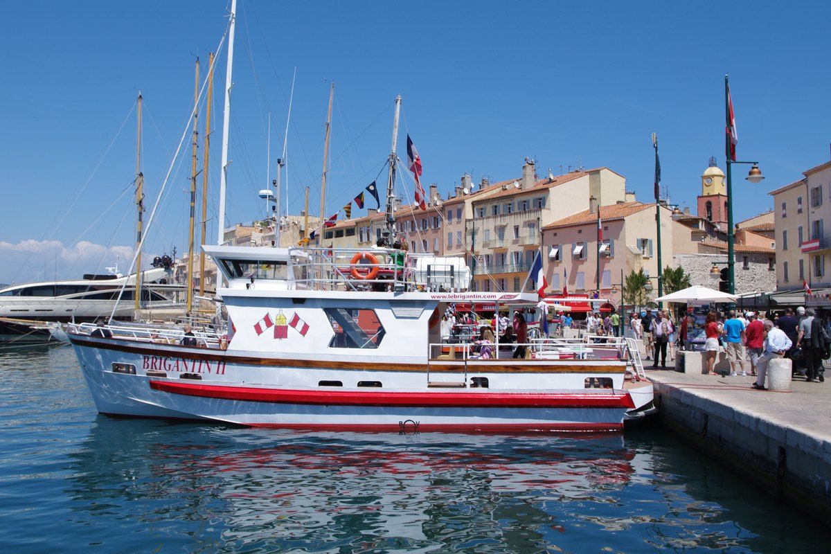 The red-and-white excursion boat Brigantin II moored on the Vieux Port quay in Saint-Tropez