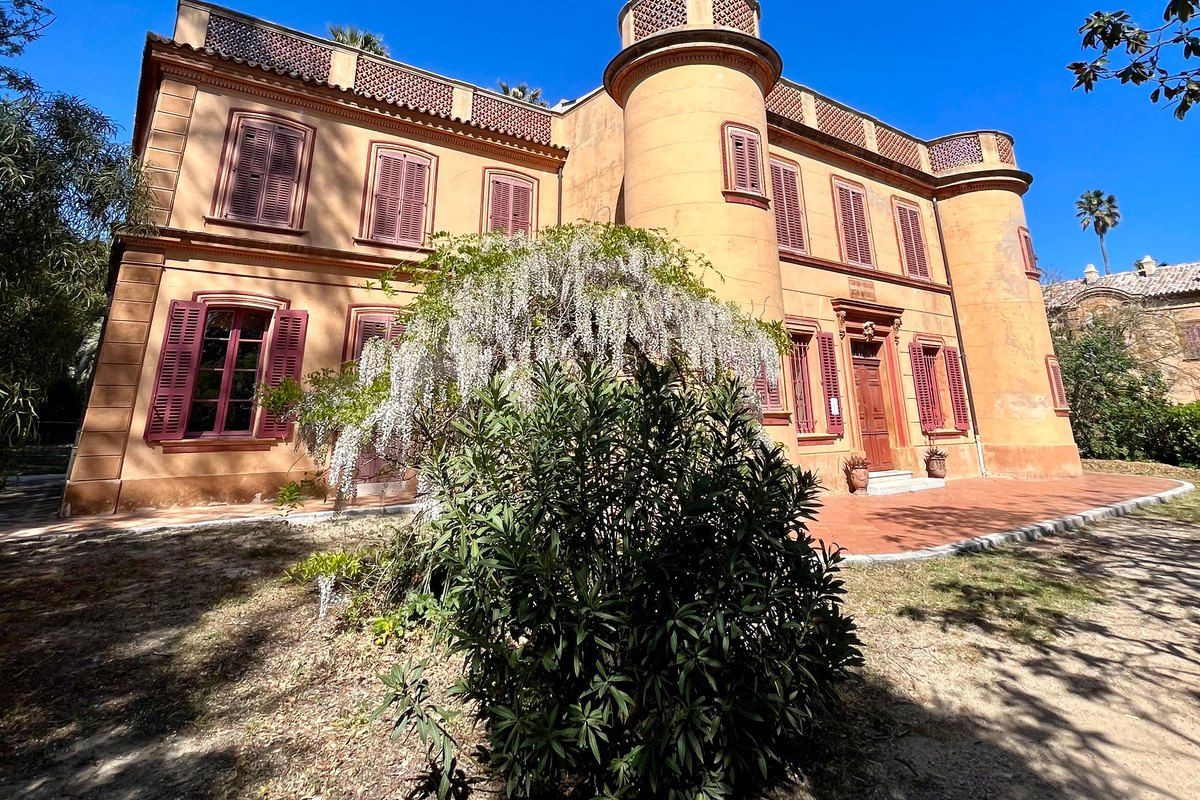 The ochre façade and corner turret of the Château de la Moutte, Émile Ollivier's house in Saint-Tropez