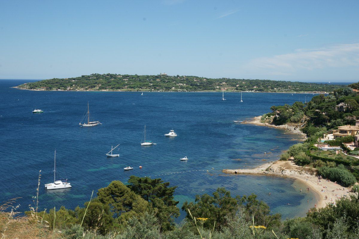 The bay below the Citadelle at Saint-Tropez, with sailing boats at anchor off the Plage des Graniers