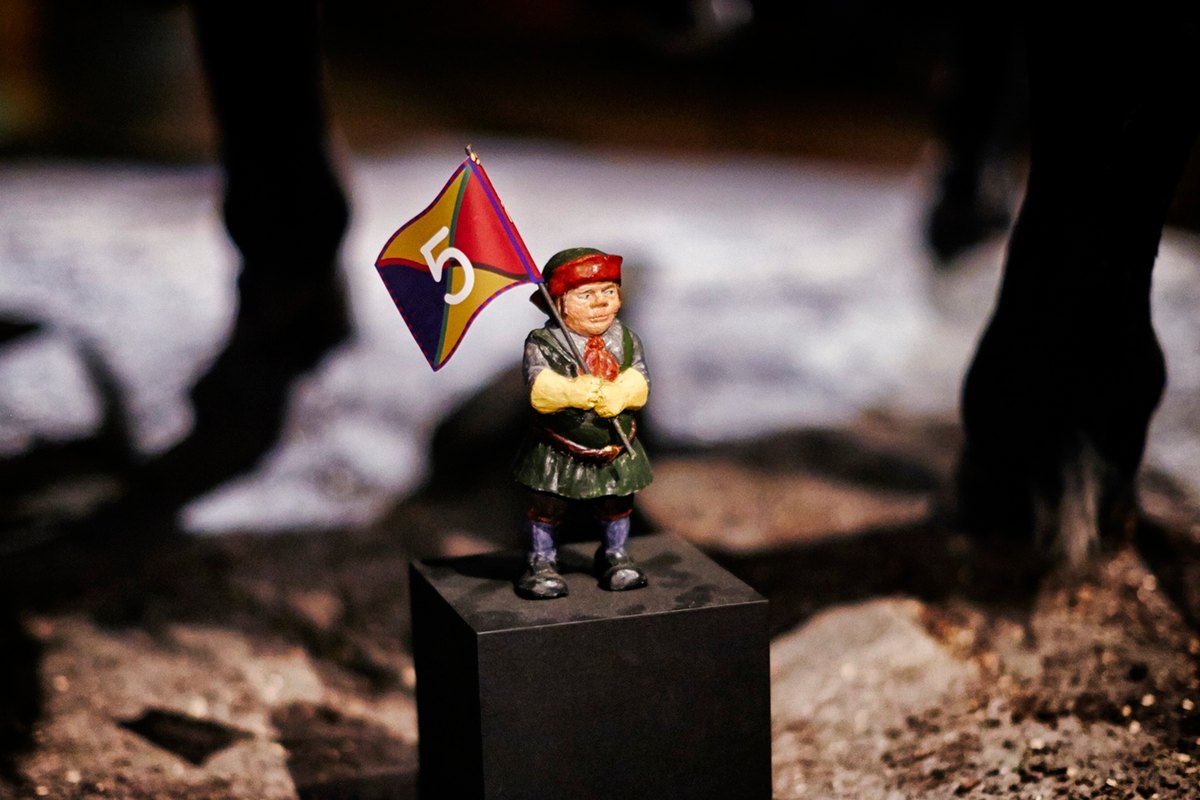A small painted soldier figure with a flag, one of the stops on the children's trail at Armémuseum