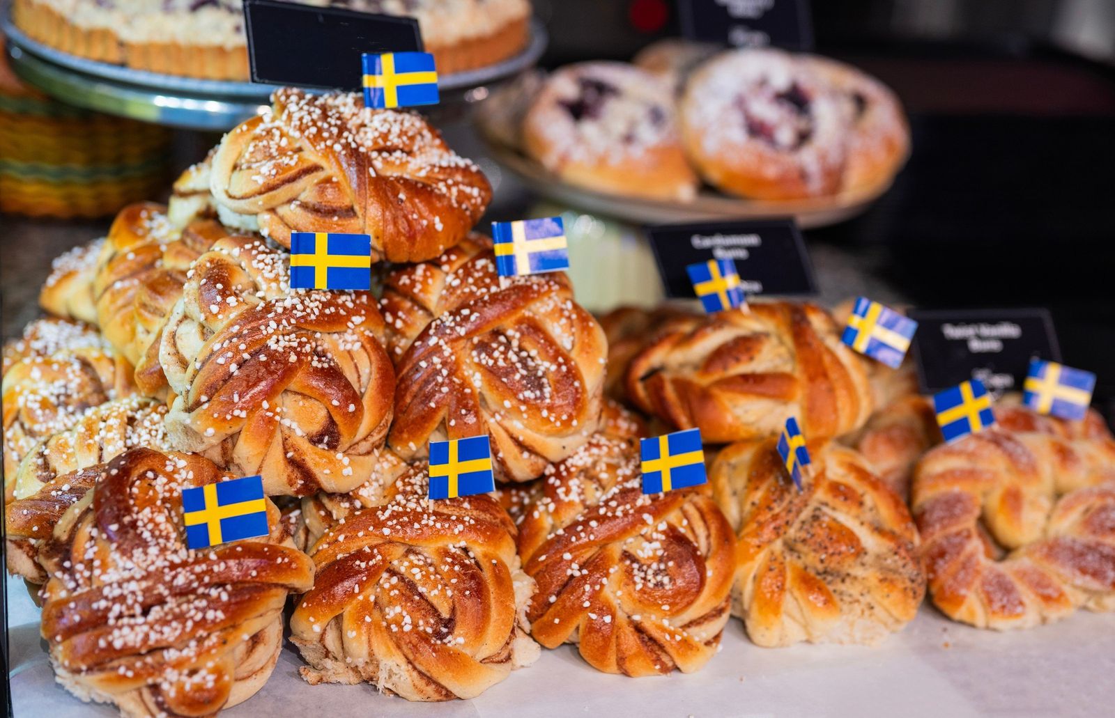 Cinnamon and cardamom buns with Swedish flags in a Stockholm café