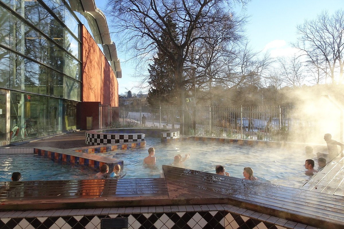 Swimmers in the steaming heated outdoor pool at Eriksdalsbadet on a frosty January day