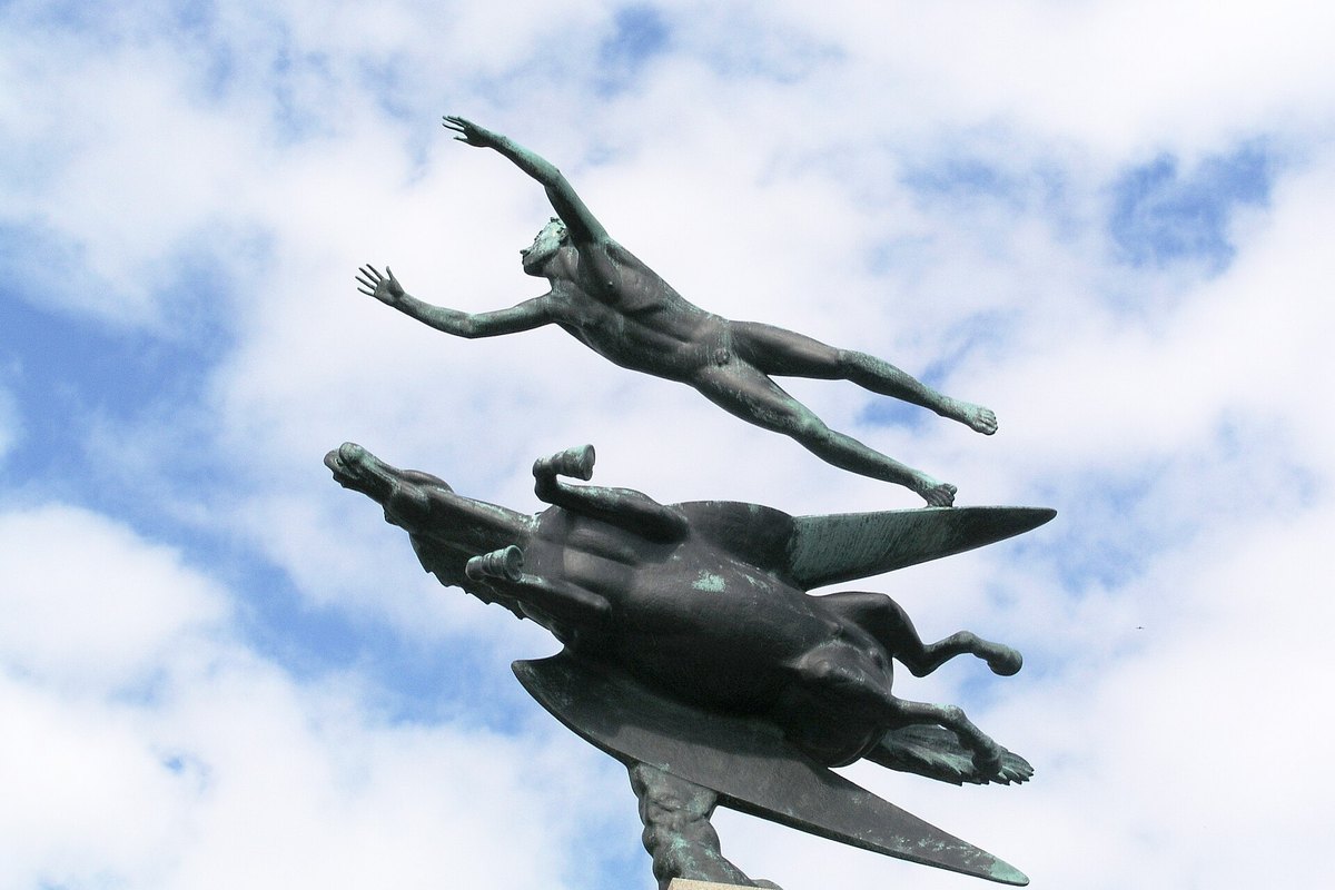 Carl Milles's bronze Man and Pegasus seeming to fly against a cloudy sky at Millesgården on Lidingö