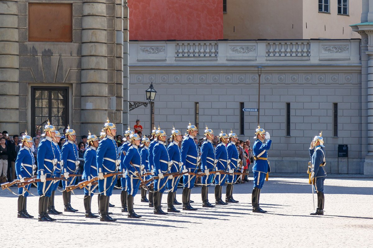 A line of Royal Guards in blue uniforms during the changing of the guard in the Outer Courtyard of the Royal Palace, Stockholm