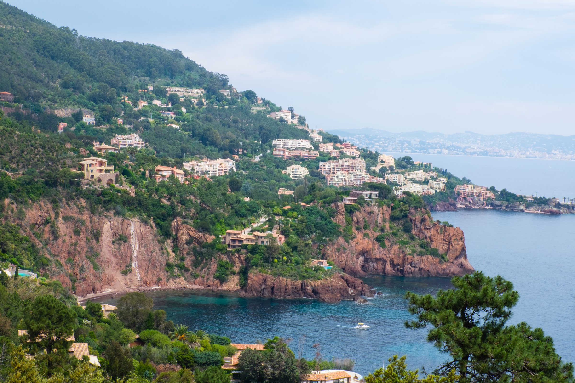 Houses on the green hillside above the sea near Théoule-sur-Mer