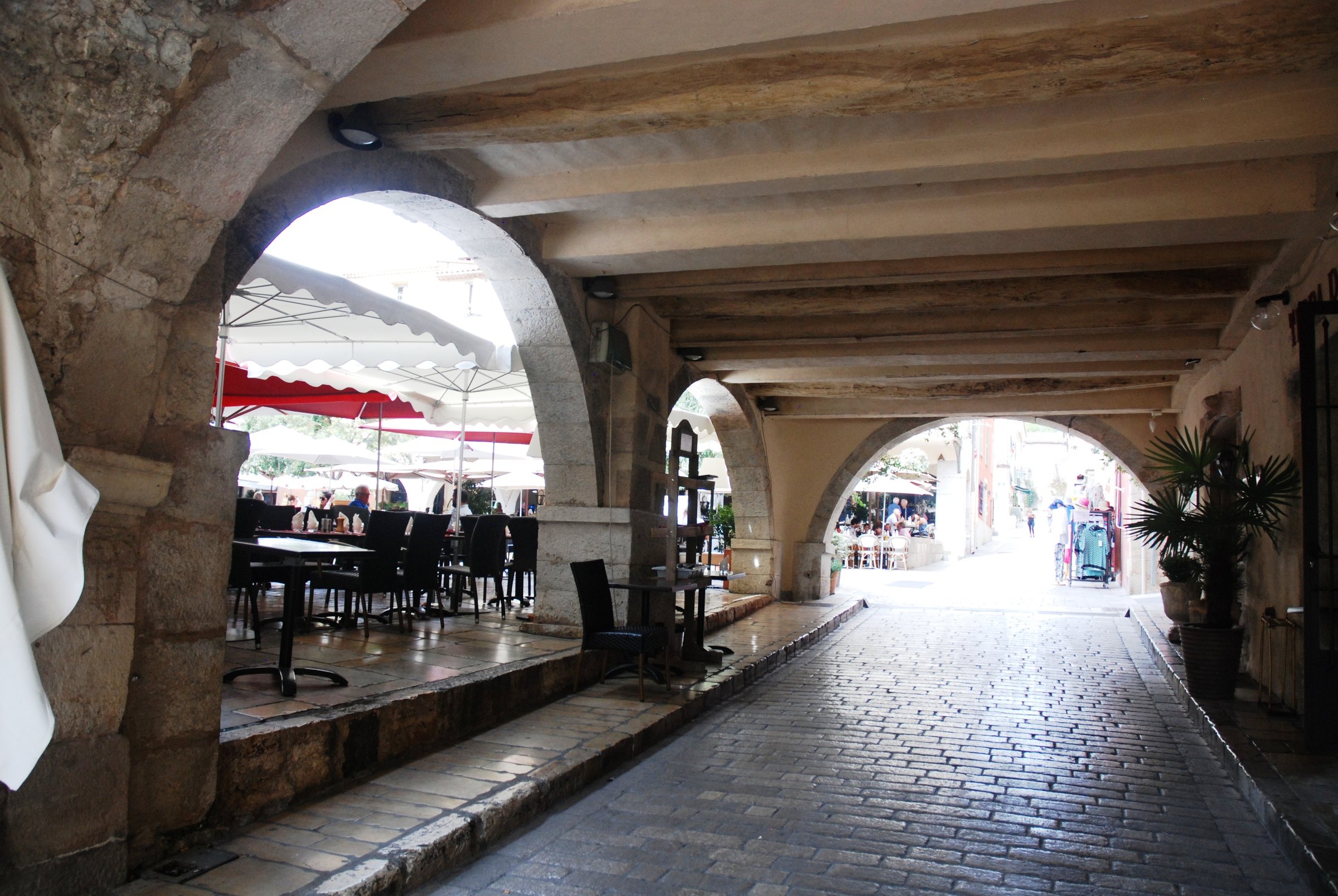 A covered passage under the arcades of Valbonne old village