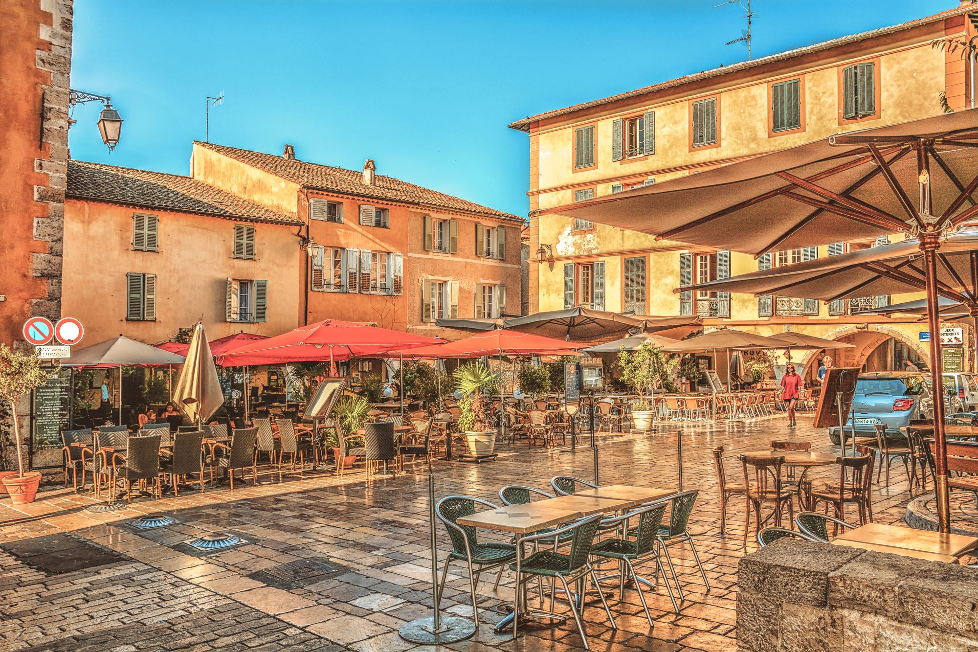 Café and restaurant terraces on a street in Valbonne