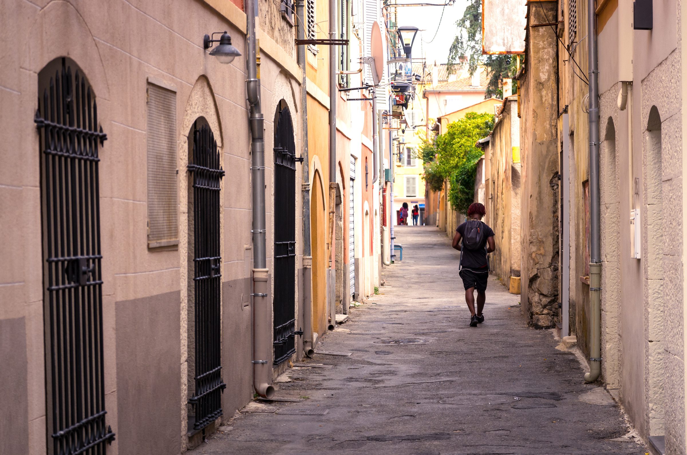 A man walking along an alley in Vallauris