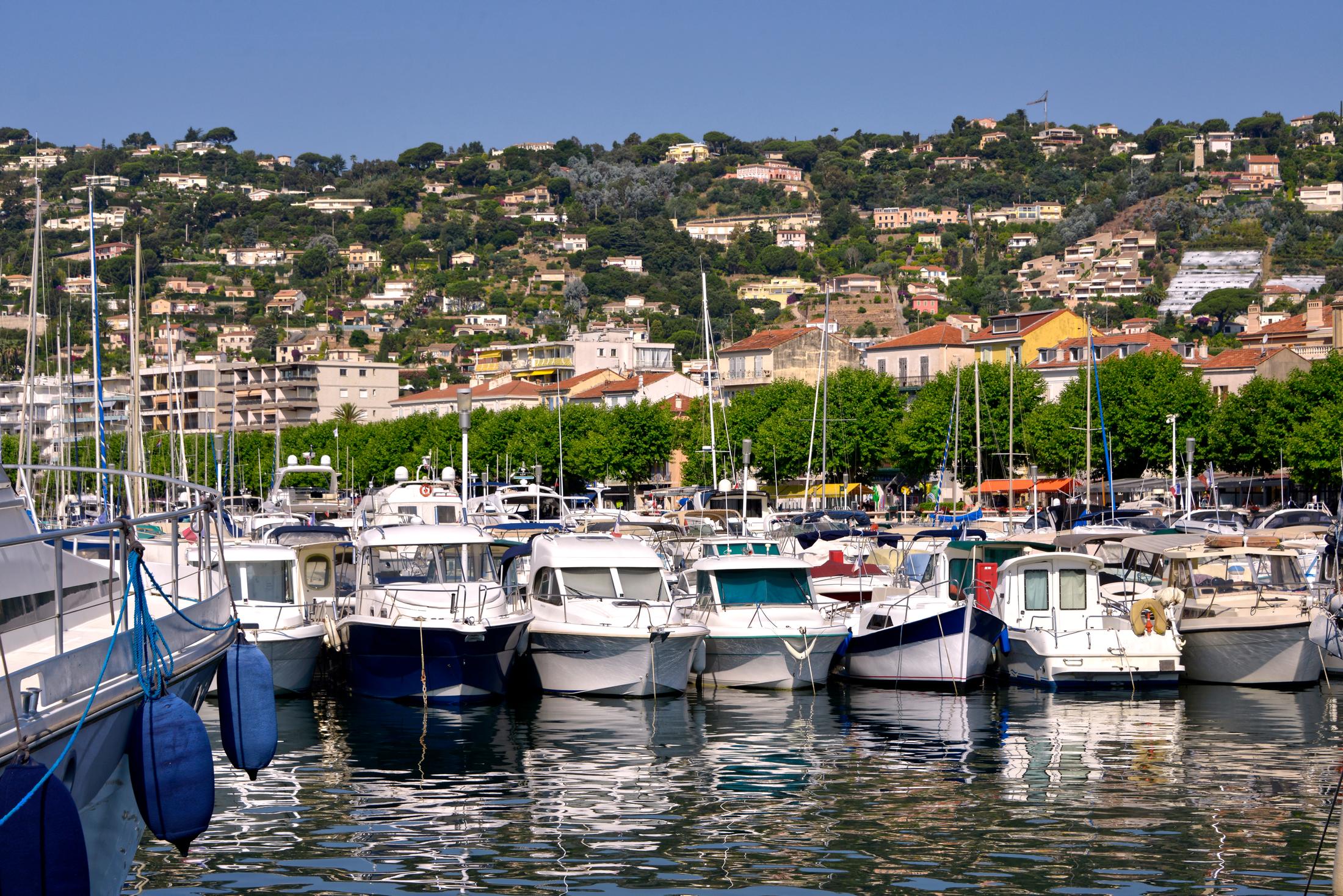 Boats in the harbour of Golfe-Juan below the hillside