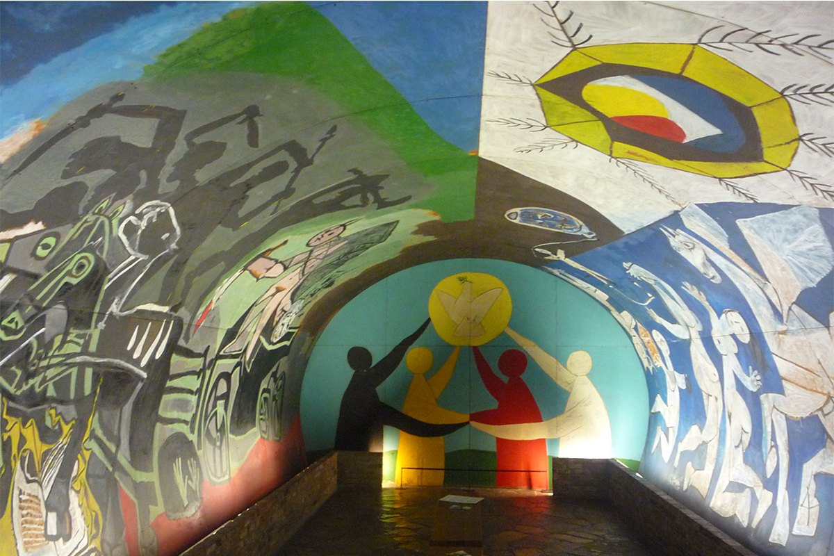 Picasso's War and Peace mural covering the vaulted ceiling of the Romanesque chapel at the château of Vallauris