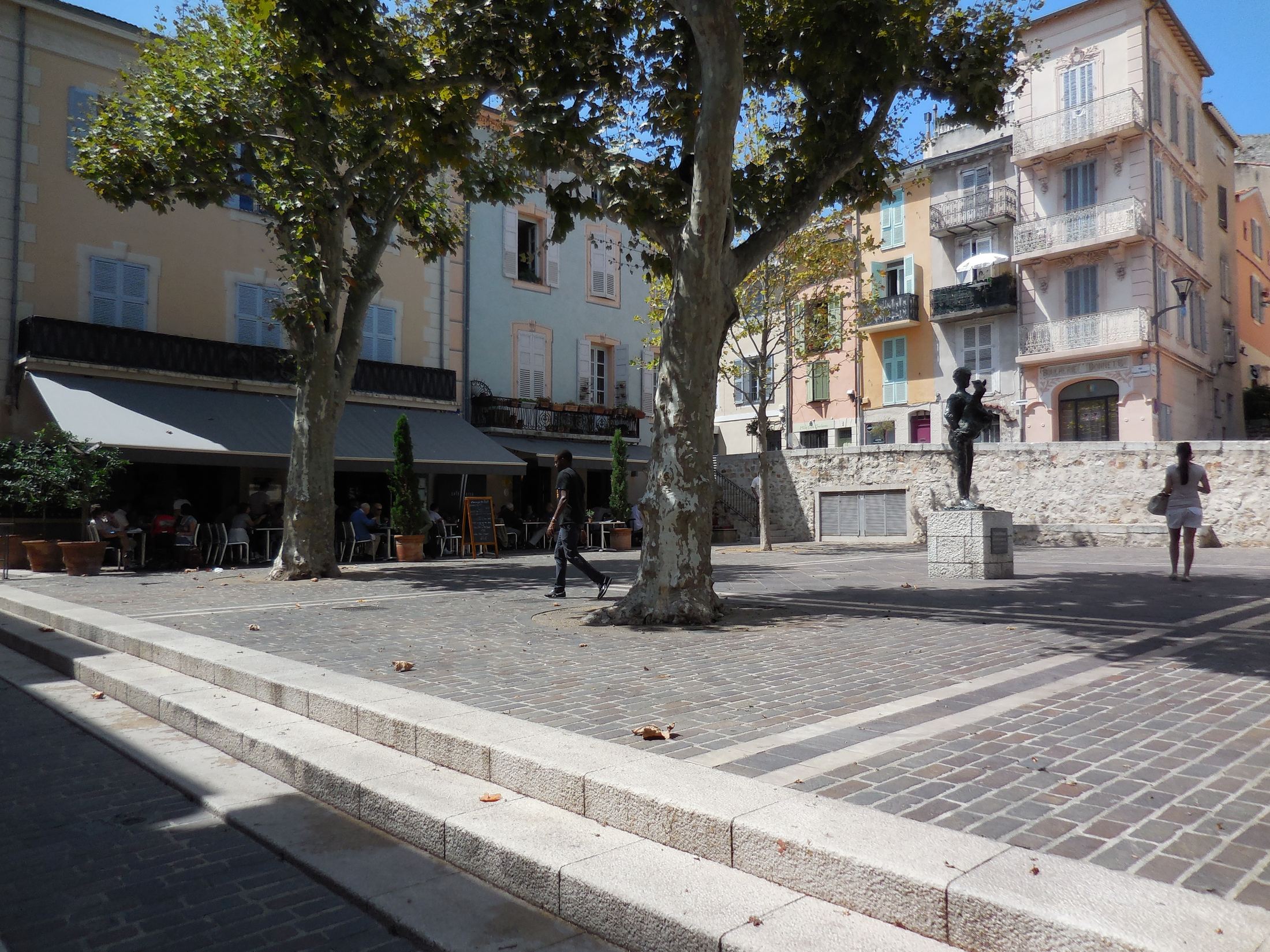 Café terraces on the square of the Man with a Sheep in Vallauris