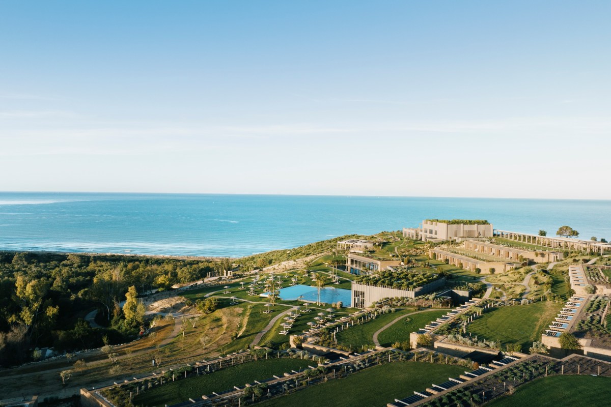 Aerial view of the ADLER Sicilia resort complex with pool, buildings, gardens and the sea beyond