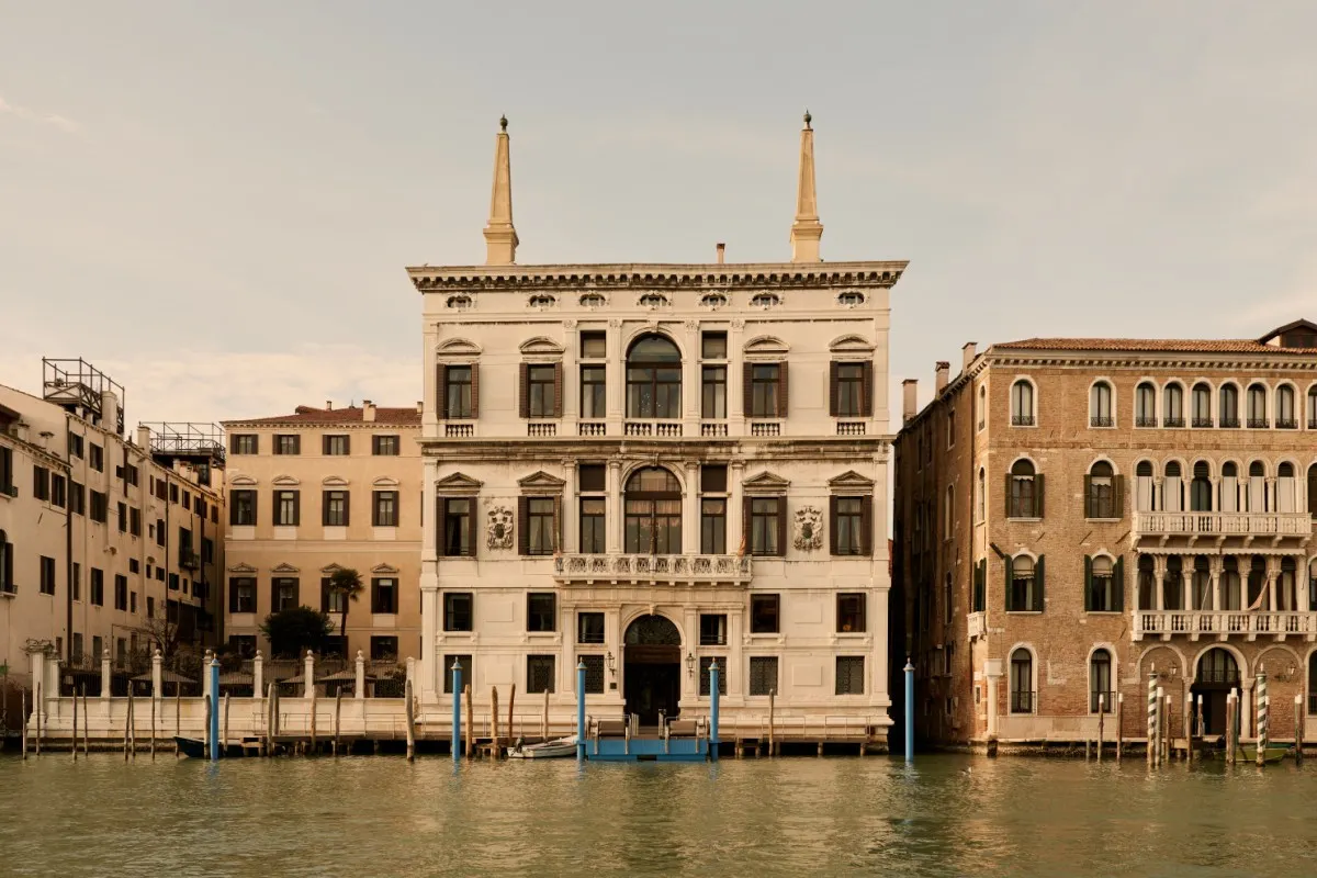 The white Renaissance façade of Palazzo Papadopoli, home of Aman Venice, on the Grand Canal