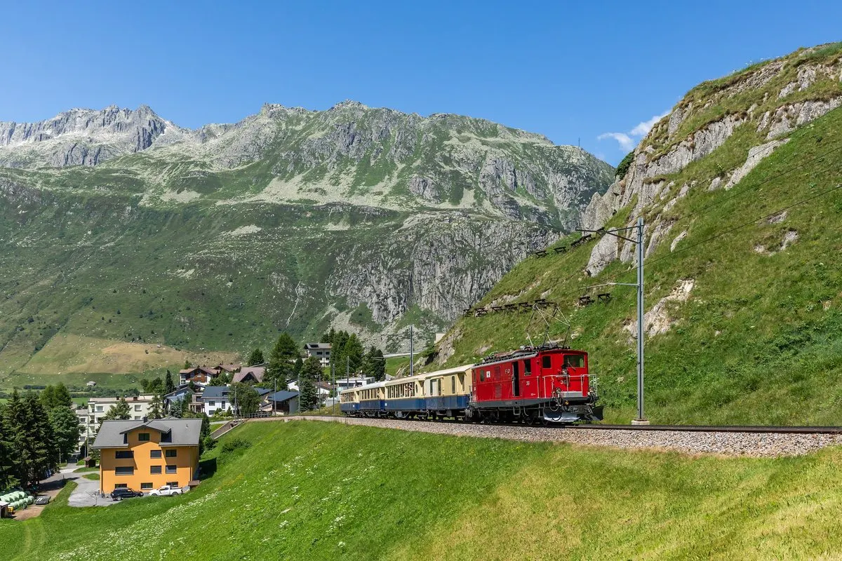 A Matterhorn Gotthard Bahn train above Andermatt in the Urseren valley