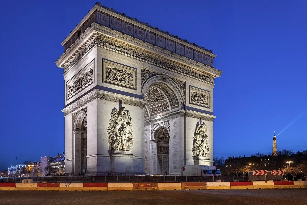 The Arc de Triomphe illuminated at night in Paris