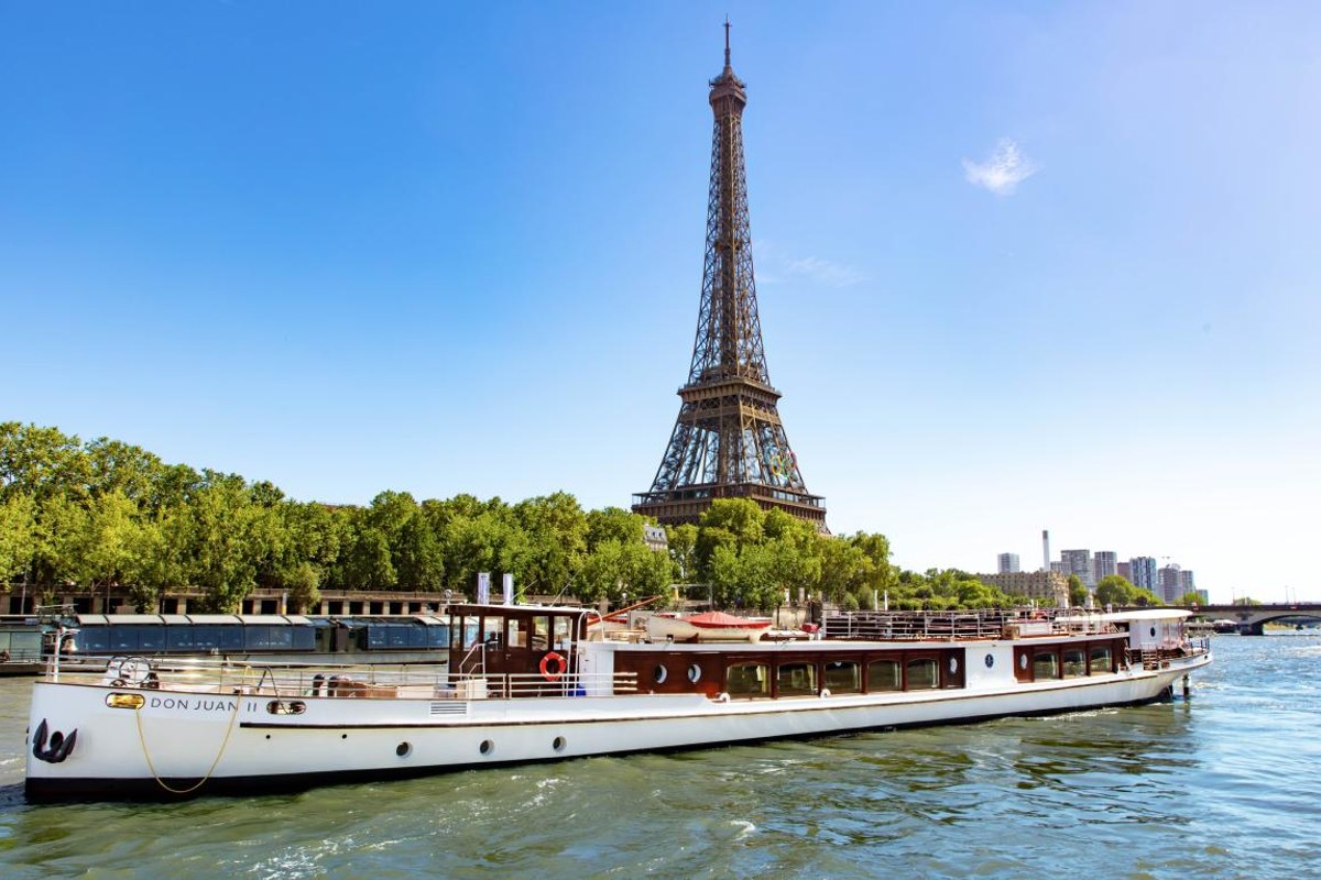 Don Juan II boat cruising on the Seine with Eiffel Tower in background