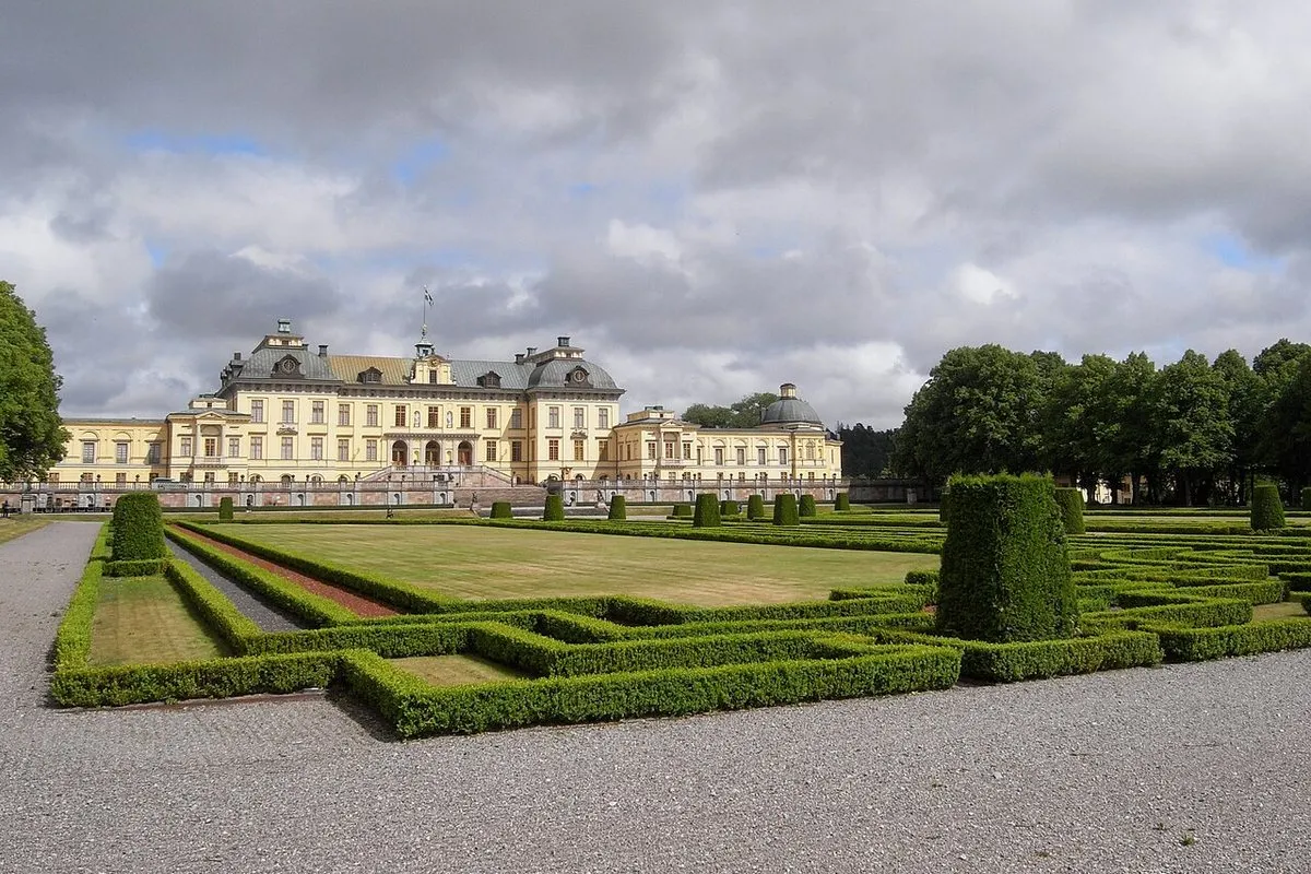 Drottningholm Palace with the baroque garden's trimmed box hedges and parterres in front of the pale palace façade