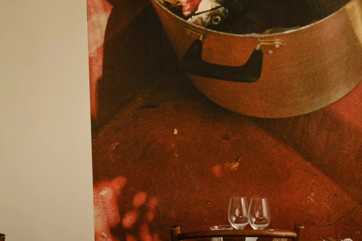 Dining room wall mural of a pot with glassware and table in foreground