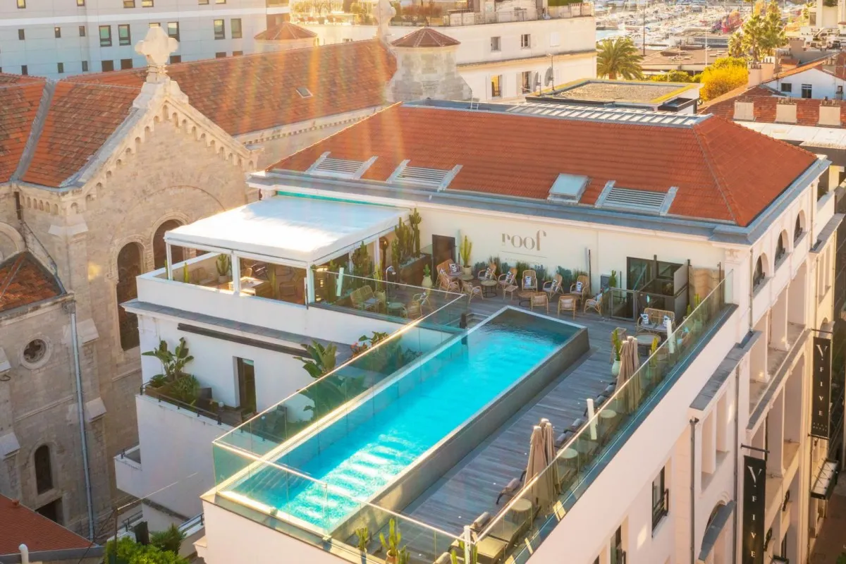 Aerial view of Five Seas hotel façade with rooftop pool and Roof terrace
