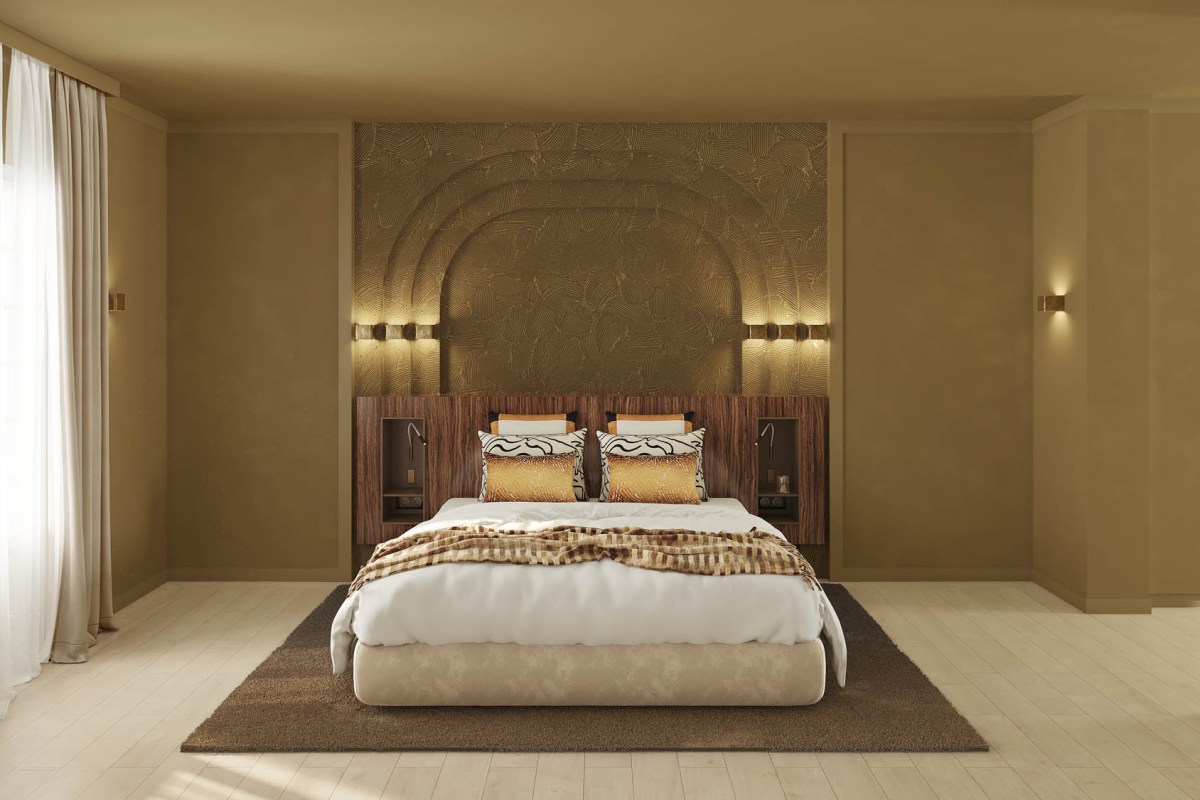 Guest bedroom with centered bed, gold textured headboard and wood floor