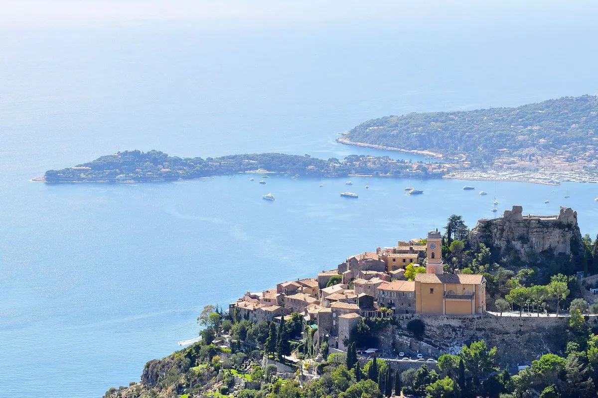 View from the Grande Corniche over the mountain village of Èze and the Cap-Ferrat peninsula in the blue sea