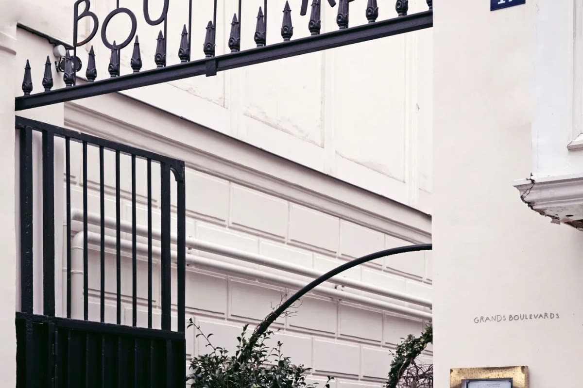 Entrance gate and facade detail with 'Grands Boulevards' signage on white stone building