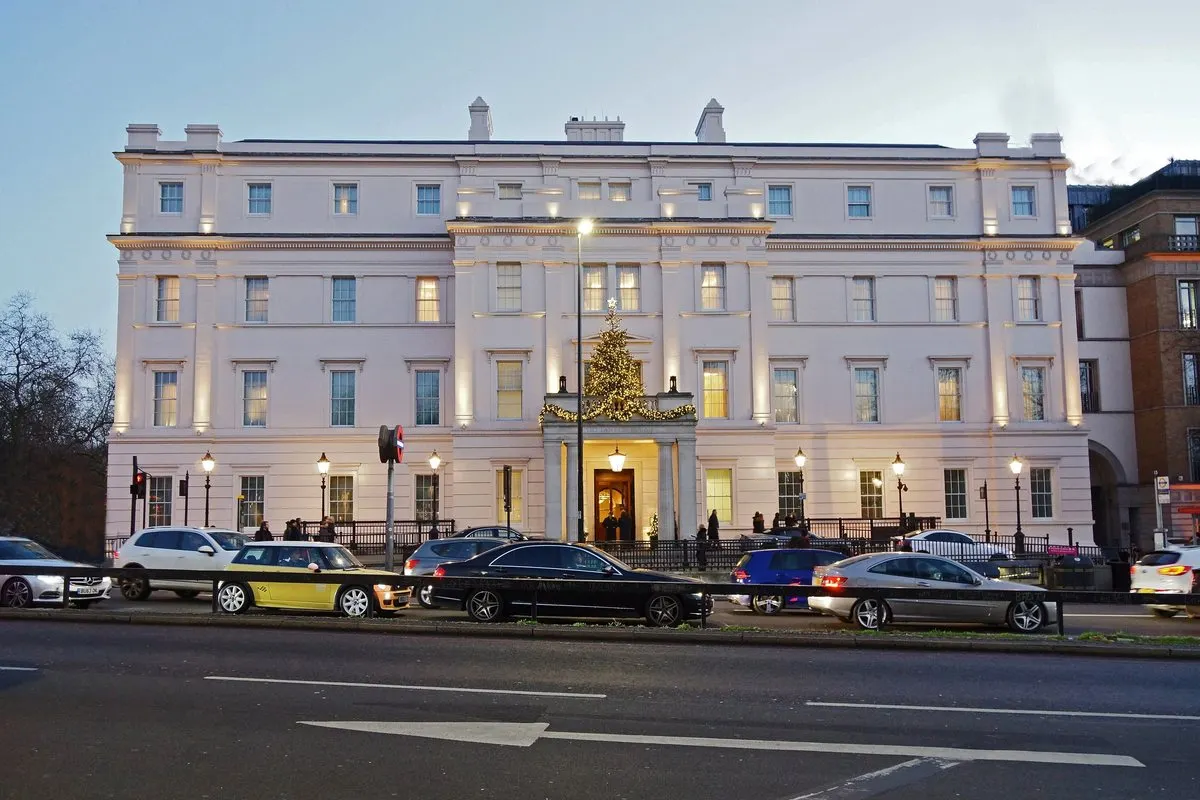 The white Regency façade of The Lanesborough at Hyde Park Corner at dusk