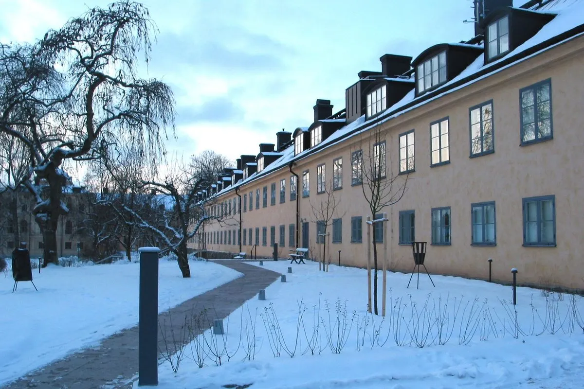 Hotel Skeppsholmen in Stockholm – the long yellow 1699 building along Gröna gången, with snow and trees on a winter's day