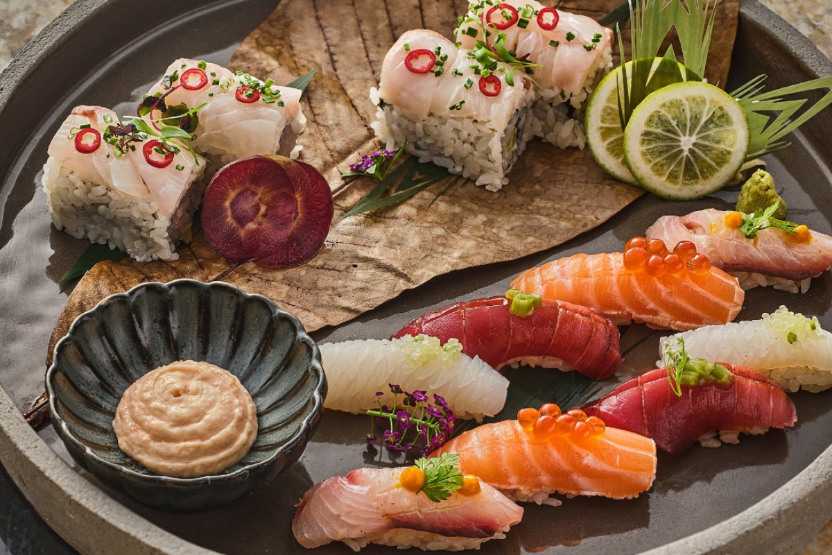 Platter of assorted sushi and sashimi with citrus and sauces at IYO restaurant