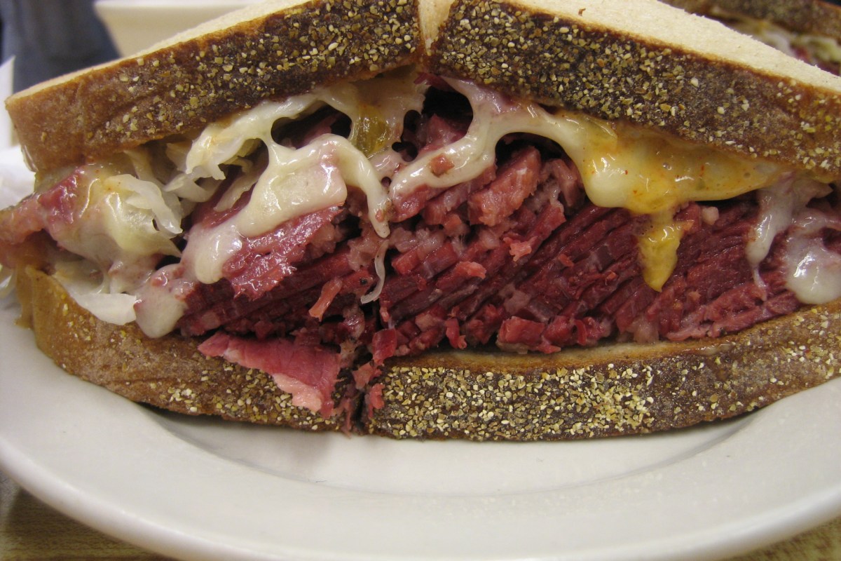 Close-up of a pastrami and corned beef sandwich on rye bread