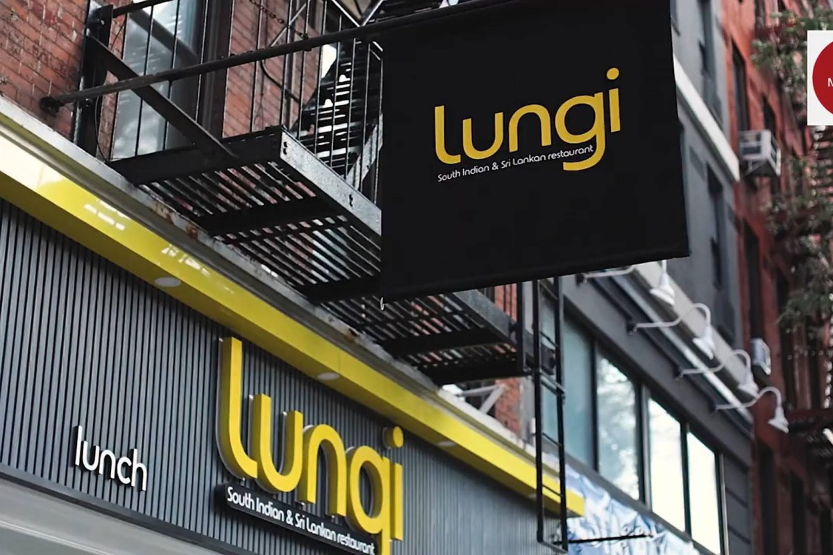 Exterior storefront sign for Lungi, a South Indian and Sri Lankan restaurant, mounted on a fire escape