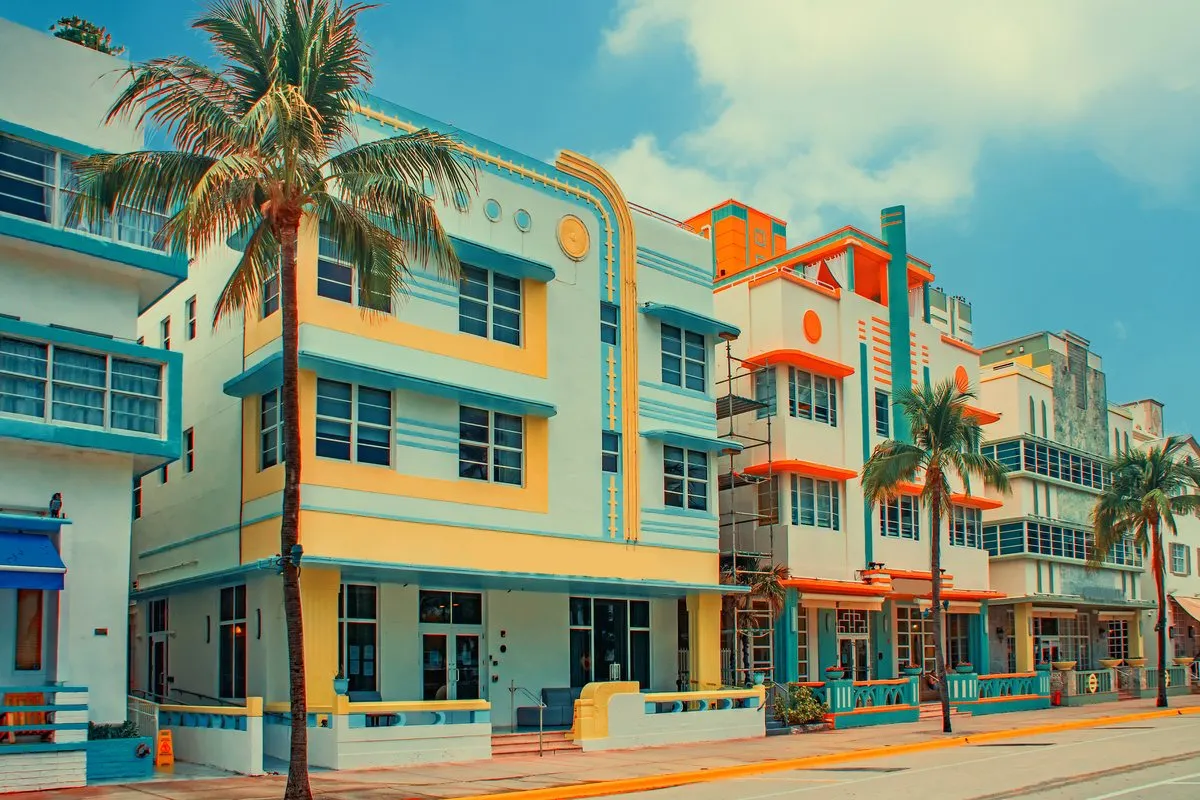 Art Deco houses in pastel colours with palm trees in Miami Beach