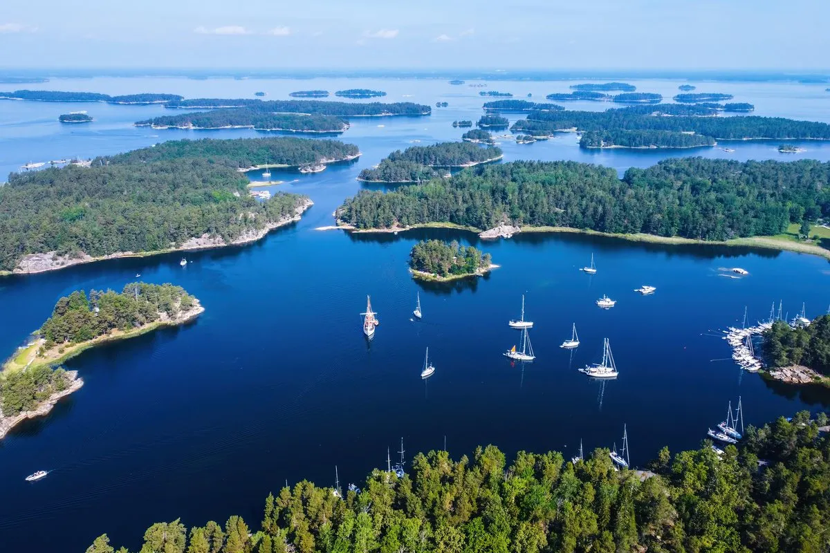 Aerial view of the Stockholm archipelago with forested islands and sailing boats