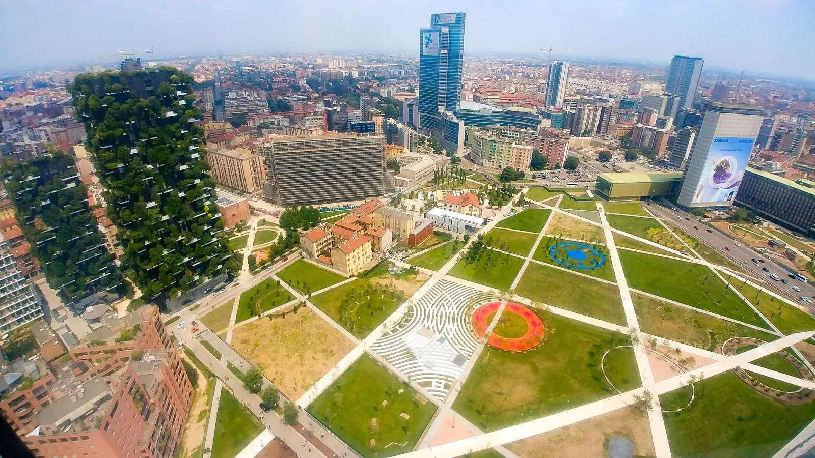 Aerial view of the Biblioteca degli Alberi park in Porta Nuova, with the Bosco Verticale on the left and the district's towers behind