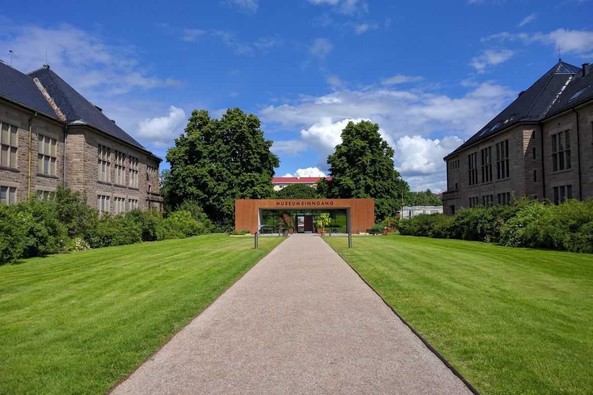 Entrance pathway leading to the Natural History Museum's modern 'Museumsinngang' entrance building in Oslo