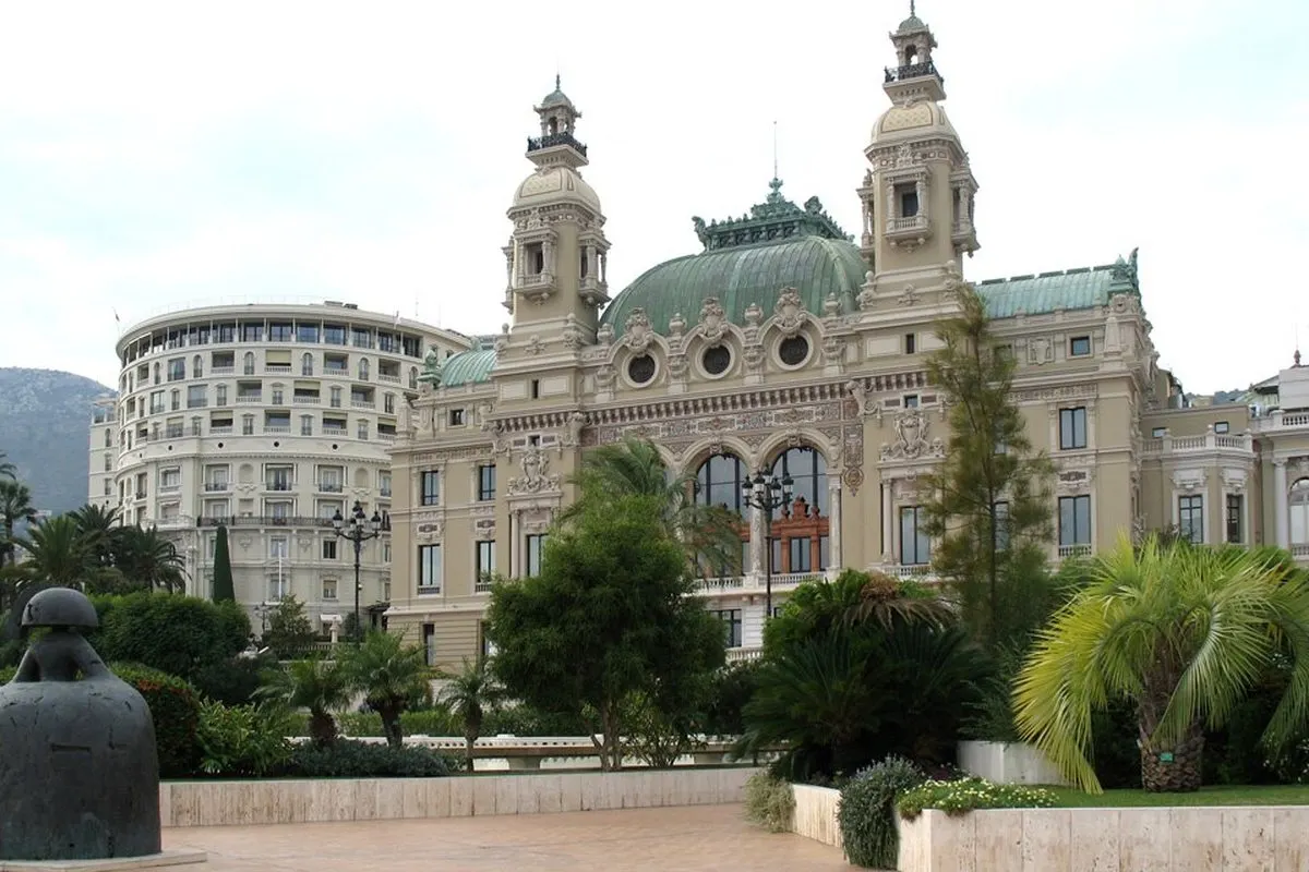 Opéra de Monte-Carlo with Charles Garnier's façade, the twin towers and the green dome, seen from the terrace facing the sea