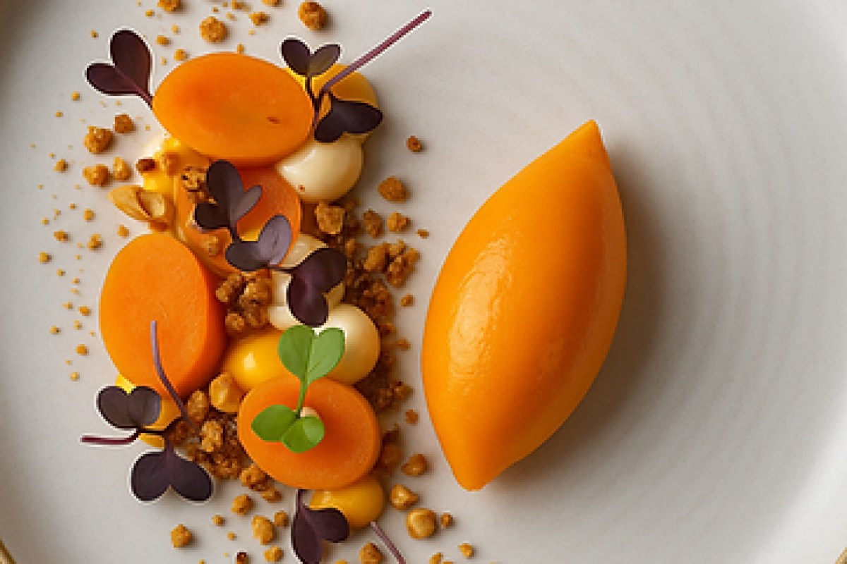 Plated dessert with carrot slices, orange sorbet quenelle, crumble and microgreens on white plate