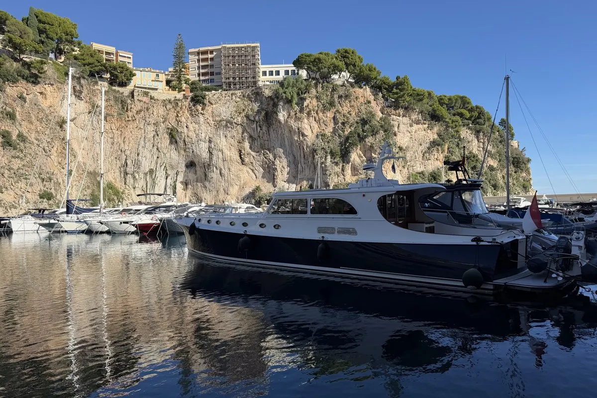 Boats in Port de Fontvieille with the Rock of Monaco behind